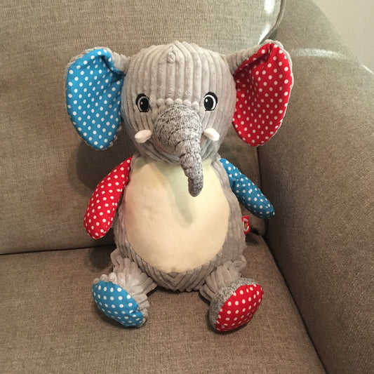 Elephant Cubbie (stuffed elephant toy) can be perchased with personalized option or blank without being personalized. Elephant has a blue with dots inner ear, arm and inner foot pad, red with dots inner ear, arm and inner foot pad