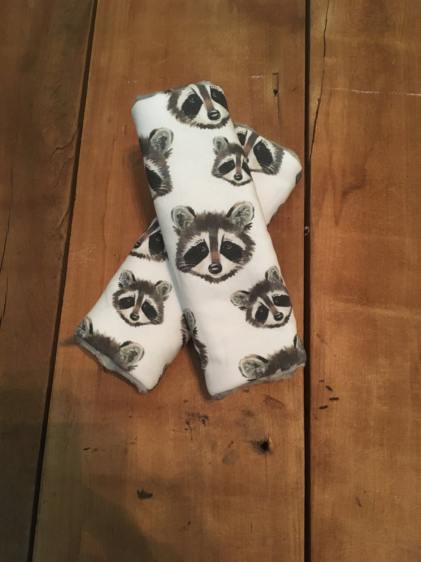 raccoon car seat strap covers shown in 6" size
