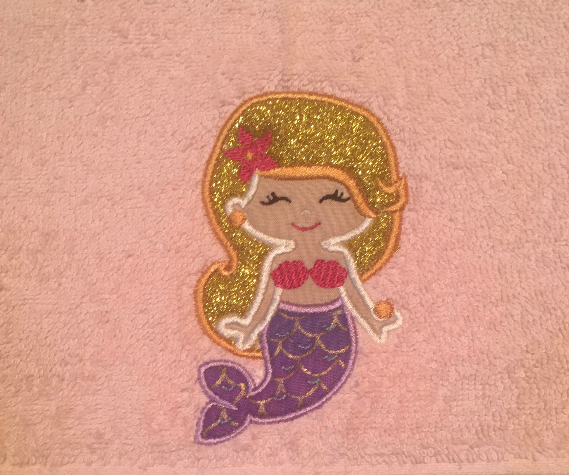 embroidered mermaid close up