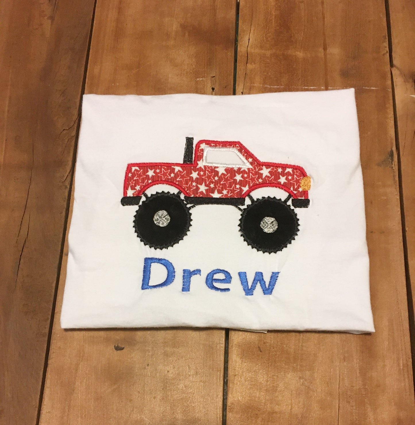monster truck shirt with white stars on a red background