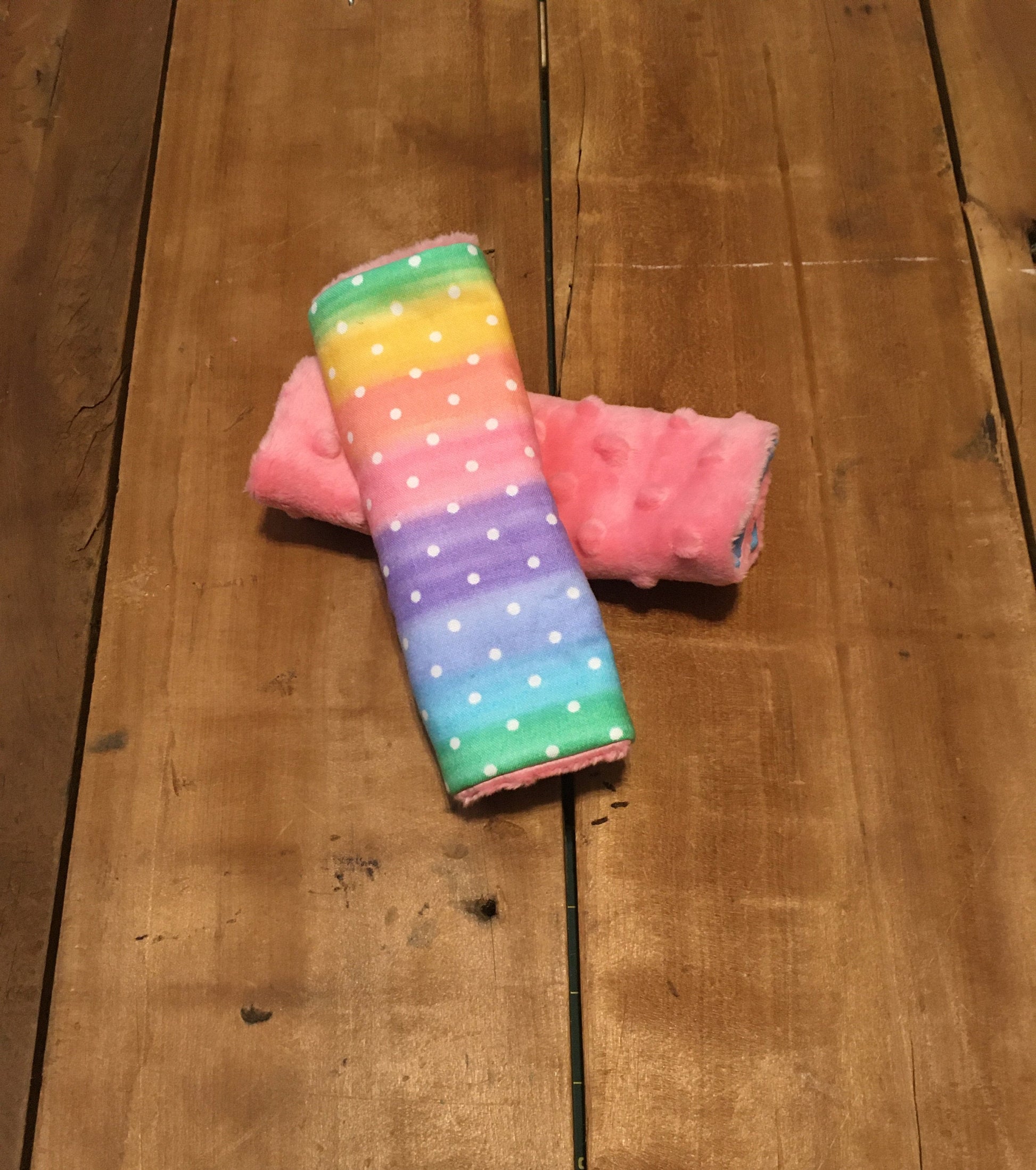 rainbow ombre stars car seat strap covers, shown in 6", with coral minky