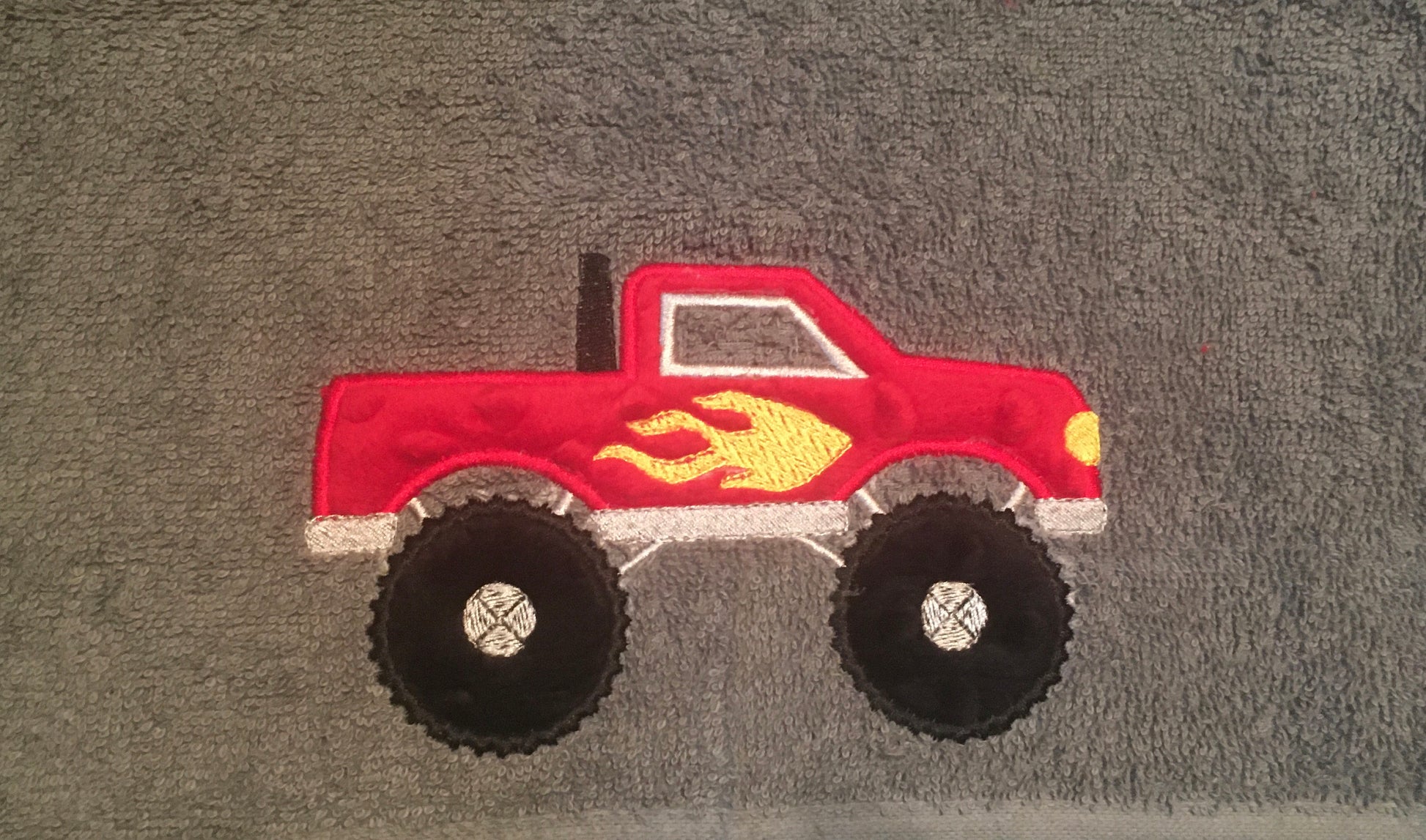red monster truck hooded towel