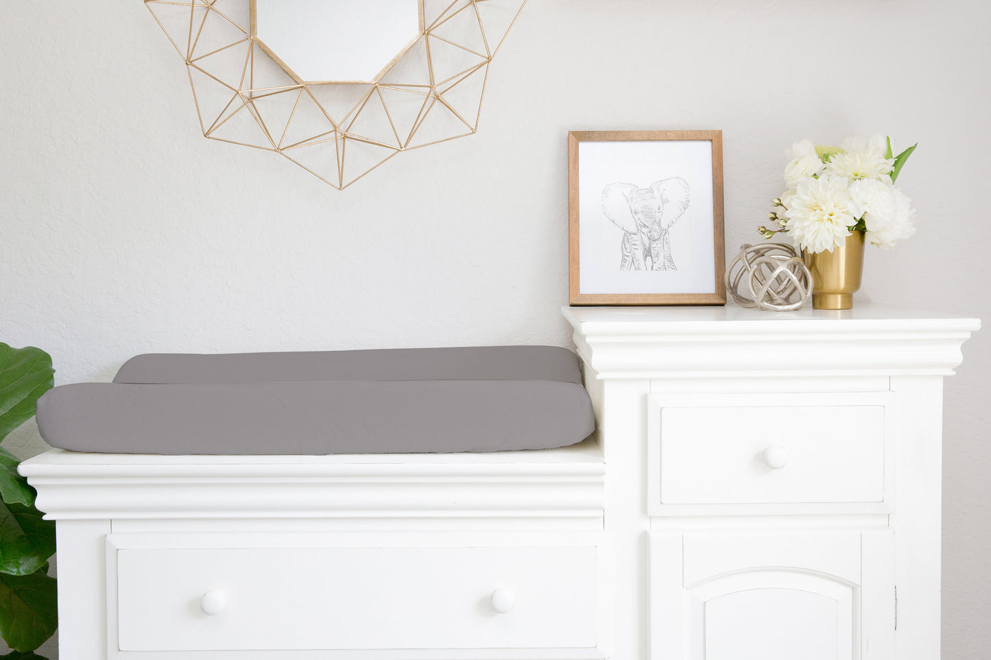 solid gray changing pad cover shown in nursery