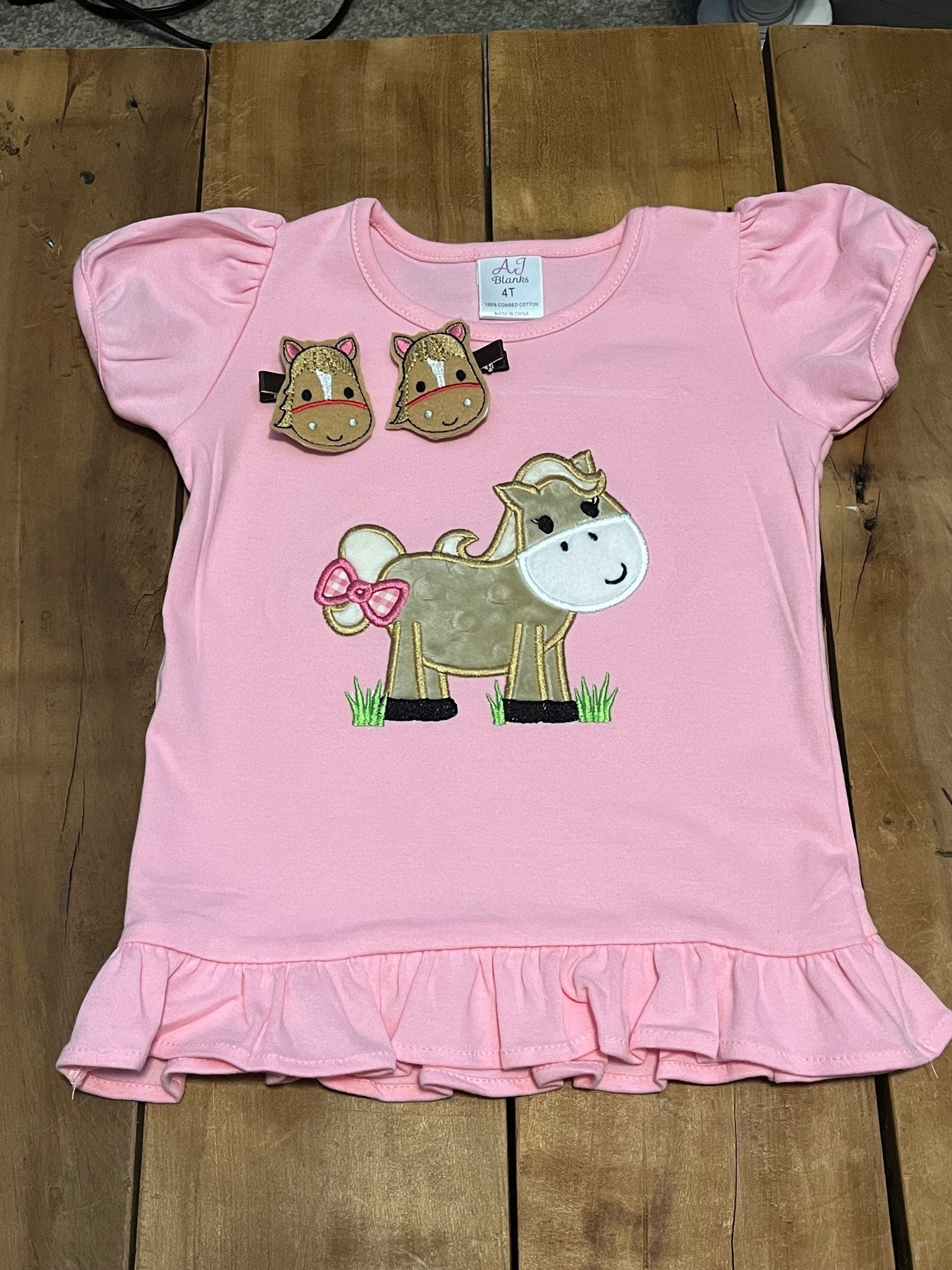 Embroidered horse shirt, shown in pink. Available in white and pink. Other colors available on request