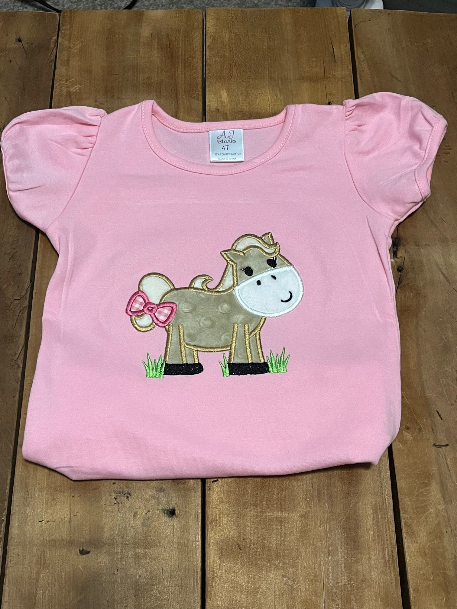 Embroidered horse shirt, shown in pink. Available in white and pink. Other colors available on request