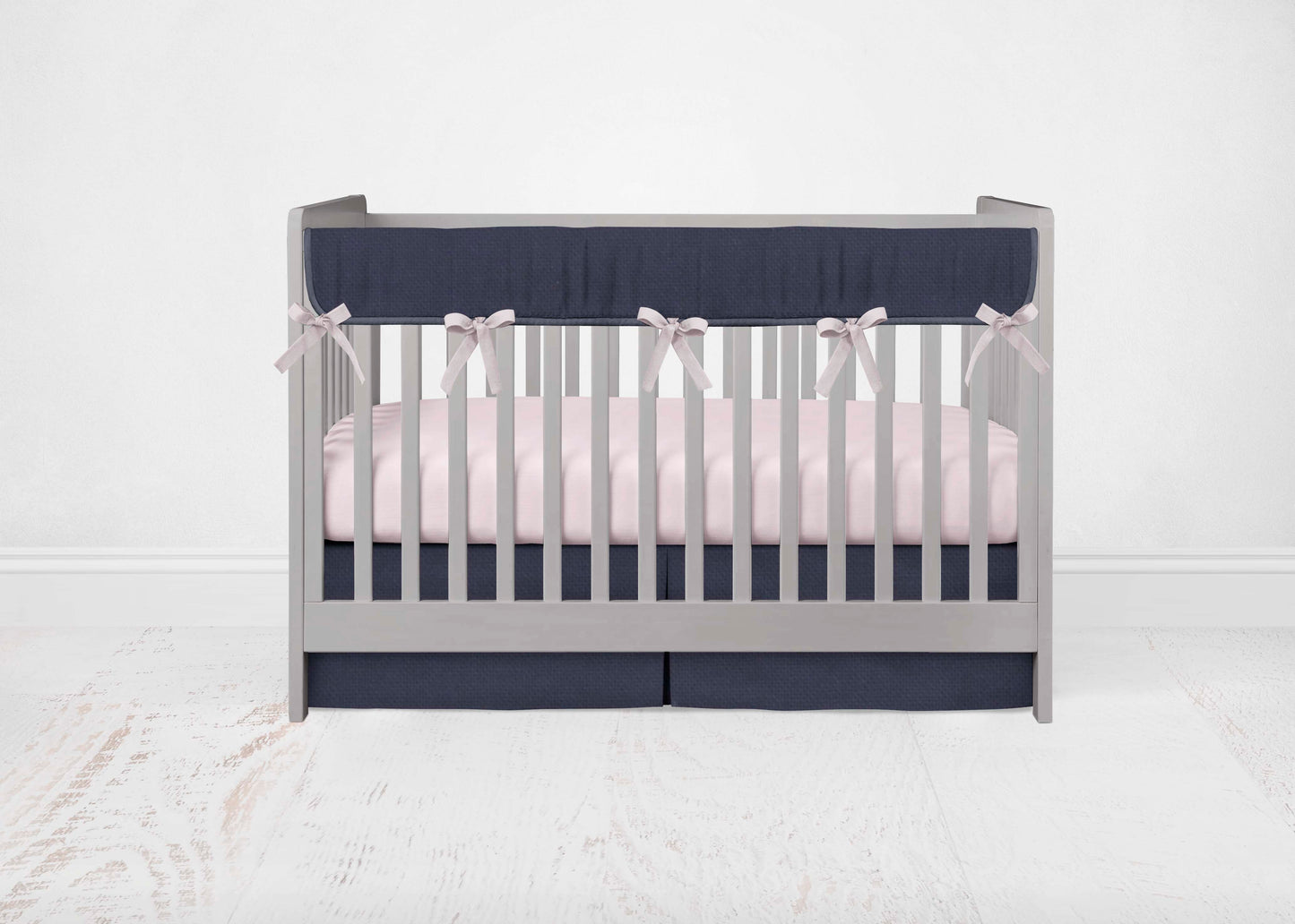 Navy Rail Cover, light pink ties, Light pink Sheet & Navy crib skirt shown in the pleat option